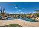 Inviting pool with a waterfall feature and spacious patio at 27432 N 66Th Way, Scottsdale, AZ 85266