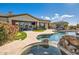 Stunning pool, spa, and patio with seating area and putting green at 27432 N 66Th Way, Scottsdale, AZ 85266
