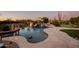 Resort-style backyard with a freeform pool and putting green at 27432 N 66Th Way, Scottsdale, AZ 85266