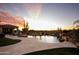 Inviting pool area with a waterfall feature and beautiful desert landscape at 27432 N 66Th Way, Scottsdale, AZ 85266