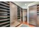 Large walk-in closet with custom shelving and drawers at 27432 N 66Th Way, Scottsdale, AZ 85266
