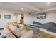 Spacious basement recreation area with large screen TV and comfortable seating at 5800 E Glen Dr, Paradise Valley, AZ 85253
