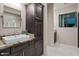 Modern bathroom with granite countertop, dark wood cabinets, and vessel sink at 5800 E Glen Dr, Paradise Valley, AZ 85253