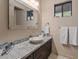 Elegant bathroom with a vessel sink and dark wood vanity at 5800 E Glen Dr, Paradise Valley, AZ 85253