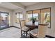Cozy breakfast nook with a round table and chairs near a patio door at 5800 E Glen Dr, Paradise Valley, AZ 85253