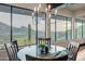 Elegant dining area with glass-top table and chairs, boasting scenic mountain views at 5800 E Glen Dr, Paradise Valley, AZ 85253