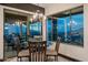 Bright dining area with a glass-top table and chairs, offering panoramic views at 5800 E Glen Dr, Paradise Valley, AZ 85253