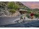 Modern home with long driveway leading to attached garage, desert landscaping at 5800 E Glen Dr, Paradise Valley, AZ 85253