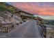 Luxury home nestled into mountainside with long driveway, desert landscaping at 5800 E Glen Dr, Paradise Valley, AZ 85253