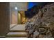Modern home with stone retaining wall, exterior stairs and landscaping at 5800 E Glen Dr, Paradise Valley, AZ 85253