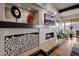 Modern fireplace with a wood stack and built-in shelving at 5800 E Glen Dr, Paradise Valley, AZ 85253