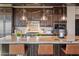 Gourmet kitchen with granite countertops, stainless steel appliances, and custom cabinetry at 5800 E Glen Dr, Paradise Valley, AZ 85253