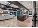 Open concept kitchen with island and hardwood floors at 5800 E Glen Dr, Paradise Valley, AZ 85253