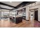 Gourmet kitchen with large island, dark cabinetry, and mountain views at 5800 E Glen Dr, Paradise Valley, AZ 85253