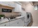 Laundry room with granite countertops and washer/dryer at 5800 E Glen Dr, Paradise Valley, AZ 85253