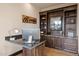 Home office with built-in cabinetry and granite desk at 5800 E Glen Dr, Paradise Valley, AZ 85253