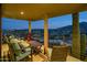 Relaxing patio with city views, comfortable seating, and a wooden table at 5800 E Glen Dr, Paradise Valley, AZ 85253