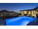 Night view of a pool with city lights at 5800 E Glen Dr, Paradise Valley, AZ 85253