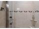 Modern shower with frameless glass door and multi-function shower panel at 5800 E Glen Dr, Paradise Valley, AZ 85253