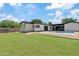 Large backyard with a newly sodded lawn and a modern home at 6733 N 14Th St, Phoenix, AZ 85014