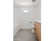 Simple bathroom with a tub and light wood cabinets at 6733 N 14Th St, Phoenix, AZ 85014