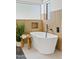 Relaxing bathroom with freestanding tub and wood accents at 6733 N 14Th St, Phoenix, AZ 85014