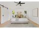 Spacious bedroom with light wood floors and a ceiling fan at 6733 N 14Th St, Phoenix, AZ 85014