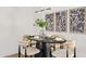 Modern dining room featuring black table and neutral chairs at 6733 N 14Th St, Phoenix, AZ 85014