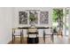 Elegant dining area with a black table and gold-accented chairs at 6733 N 14Th St, Phoenix, AZ 85014