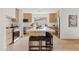 Modern kitchen with light wood cabinets and a large island at 6733 N 14Th St, Phoenix, AZ 85014