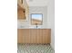 Clean laundry room with modern cabinets and geometric tile floor at 6733 N 14Th St, Phoenix, AZ 85014