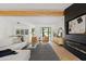 Open living space with a modern fireplace and access to backyard at 6733 N 14Th St, Phoenix, AZ 85014