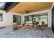 Relaxing patio features wooden furniture and a patterned rug at 6733 N 14Th St, Phoenix, AZ 85014