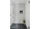Modern shower with terrazzo tile and glass enclosure at 6733 N 14Th St, Phoenix, AZ 85014