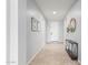 Bright and airy entryway with tile floors and a modern console table at 7109 E Plata Ave, Mesa, AZ 85212