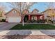 Two-story house with tan and red exterior, landscaping, and a two-car garage at 7109 E Plata Ave, Mesa, AZ 85212