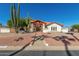 Beautiful home exterior with a landscaped front yard and walkway at 7702 W Bluefield Ave, Glendale, AZ 85308