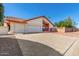 Two-car garage with a long driveway at 7702 W Bluefield Ave, Glendale, AZ 85308