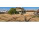 Large backyard with mature trees and a view of the home at 10407 W Catalina Dr, Avondale, AZ 85392