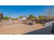 Large backyard with gravel, wooden fence, and gated entrance at 10407 W Catalina Dr, Avondale, AZ 85392