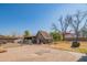 Spacious backyard features a shed, mature trees and a large open area at 10407 W Catalina Dr, Avondale, AZ 85392