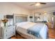 Main bedroom with plush bed, mirrored closet, and ceiling fan at 10407 W Catalina Dr, Avondale, AZ 85392