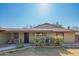 Ranch style home with carport and mature landscaping at 10407 W Catalina Dr, Avondale, AZ 85392