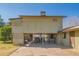 Elevated home exterior with covered parking underneath at 10407 W Catalina Dr, Avondale, AZ 85392