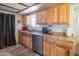 Well-equipped kitchen boasts ample cabinetry, granite counters, and stainless steel appliances at 10407 W Catalina Dr, Avondale, AZ 85392