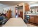 Functional kitchen with wooden cabinets, an eat-in area and tile countertops at 10407 W Catalina Dr, Avondale, AZ 85392