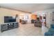 Living area with tile floors, open concept floorplan, and views of the dining area at 10407 W Catalina Dr, Avondale, AZ 85392