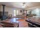 Open floor plan living room featuring a wood burning stove and french doors at 10407 W Catalina Dr, Avondale, AZ 85392