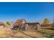 A-frame shed with ladder and adjacent storage building at 10407 W Catalina Dr, Avondale, AZ 85392