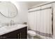 Stylish bathroom with dark vanity, marble countertop, and updated fixtures at 1102 W Lindner Ave, Mesa, AZ 85210